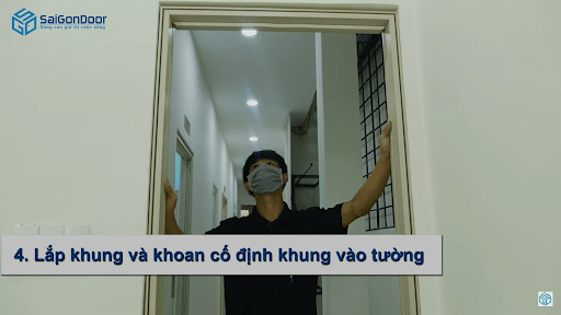 Lắp khung và khoan cố định khung bao vào ô tường